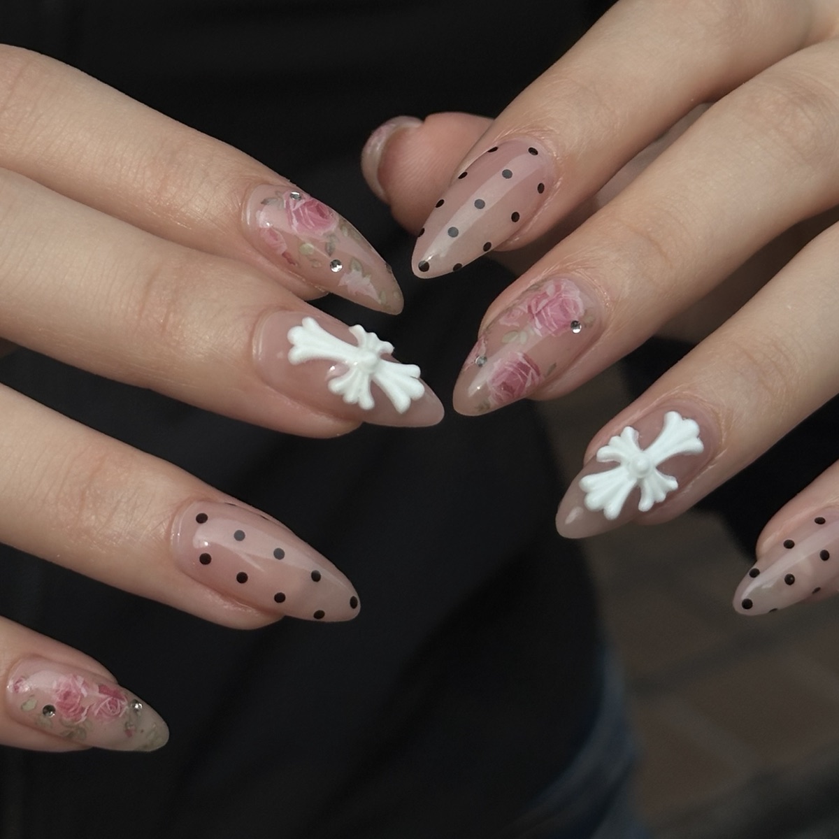 Y2K gel nail art with white 3D cross charms and polka dots at blancher nail salon in Hiroo, Tokyo
